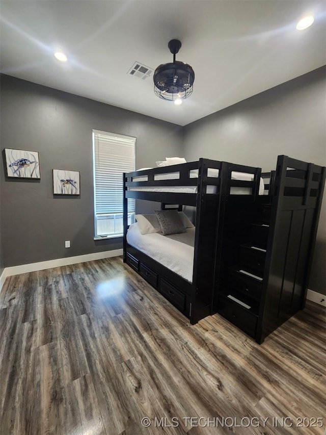 bedroom featuring dark hardwood / wood-style flooring