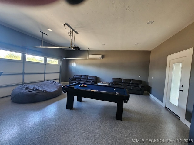 rec room with pool table and a wall mounted AC