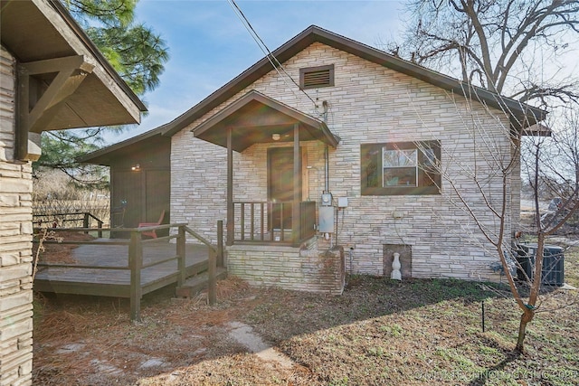 view of front of house featuring a deck and central air condition unit