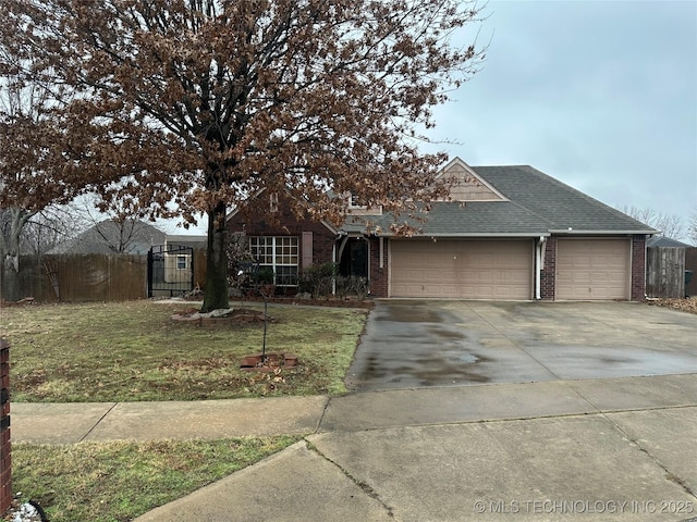 view of front of home with a garage and a front yard