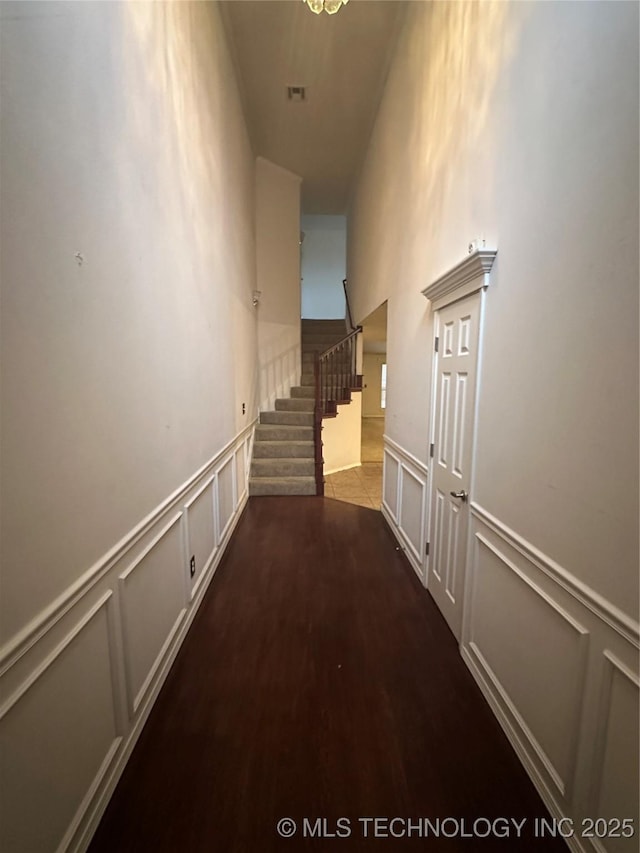 hallway with dark hardwood / wood-style floors