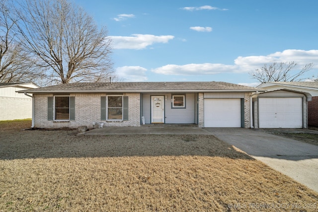 ranch-style house with a garage and a front lawn