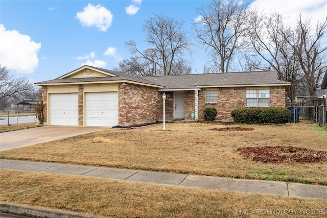 ranch-style house featuring a garage and a front yard