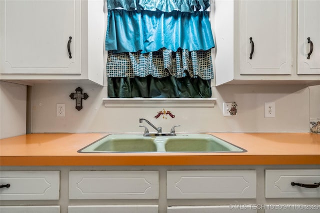 kitchen with sink and white cabinets