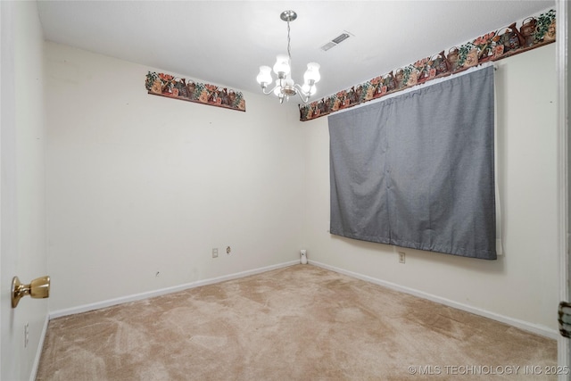 unfurnished room with carpet floors and a notable chandelier