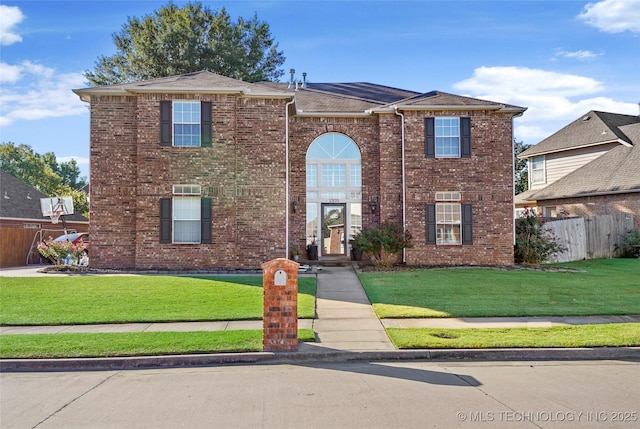 front facade with a front yard