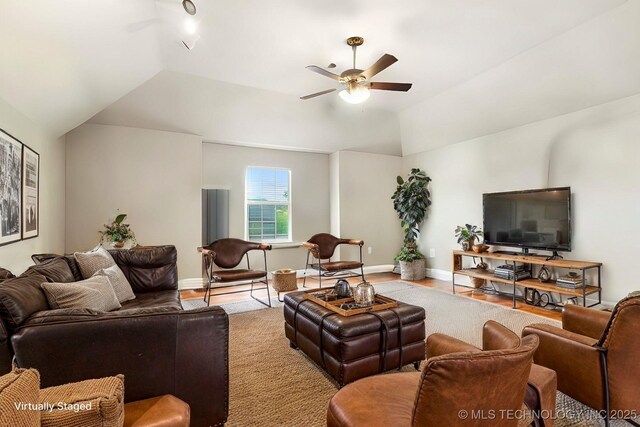 living room with lofted ceiling and ceiling fan