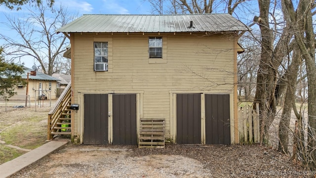 back of house with an outdoor structure