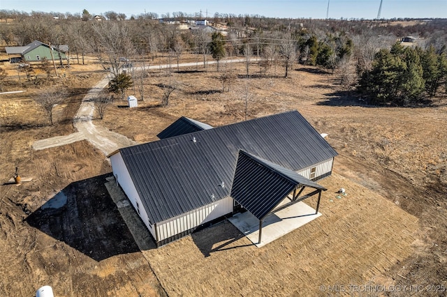 birds eye view of property with a rural view