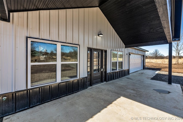 view of patio / terrace featuring a garage