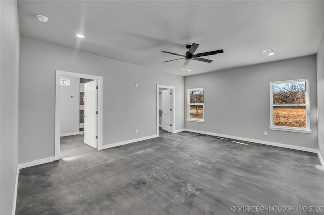 unfurnished room with a healthy amount of sunlight and ceiling fan