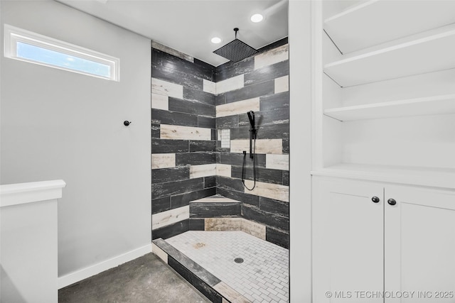 bathroom with tiled shower