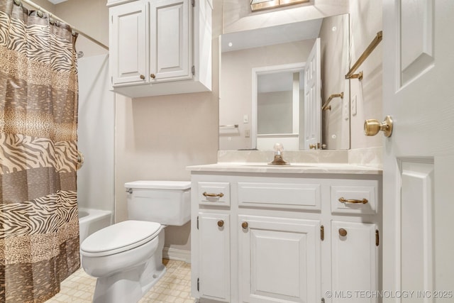 full bathroom with vanity, shower / tub combo, and toilet