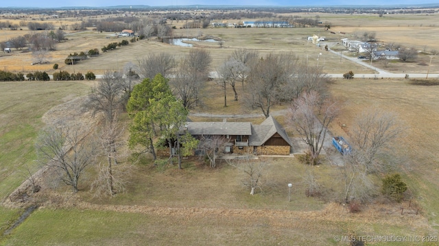 birds eye view of property with a rural view