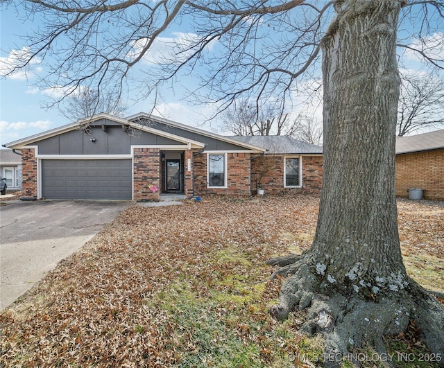 ranch-style home featuring a garage