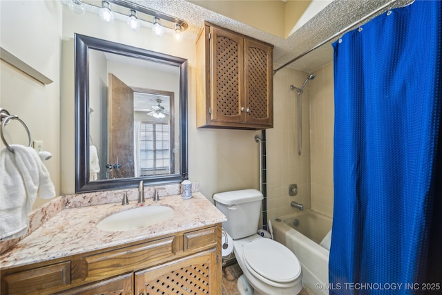 full bathroom featuring shower / bathtub combination with curtain, vanity, and toilet