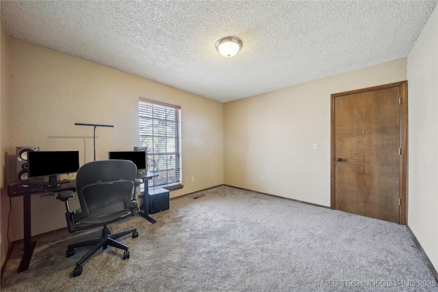 office space with carpet floors and a textured ceiling