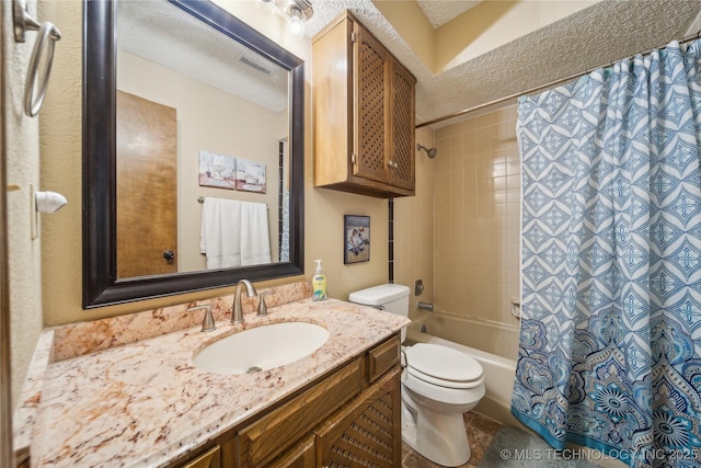 full bathroom featuring vanity, toilet, shower / tub combo, and a textured ceiling