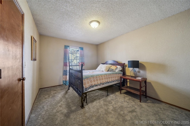 bedroom with a textured ceiling and carpet flooring