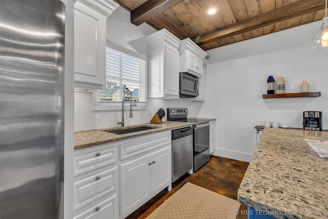 kitchen featuring light stone counters, stainless steel appliances, sink, and white cabinets