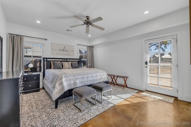 bedroom with multiple windows, access to exterior, and ceiling fan