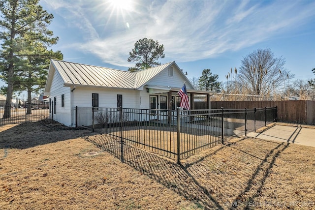 rear view of house with a yard