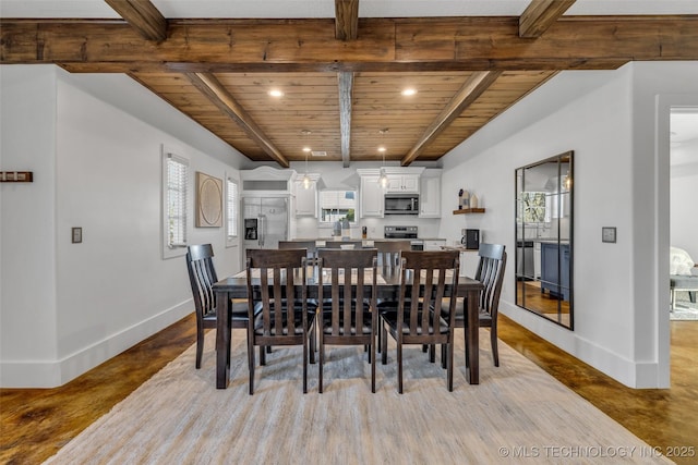 dining space with beamed ceiling and wood ceiling