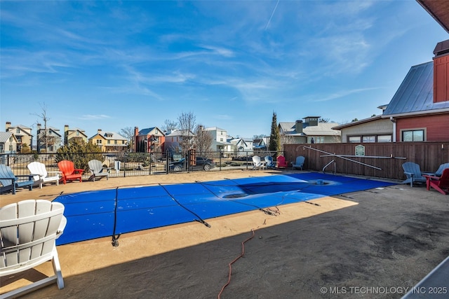 view of swimming pool featuring a patio area