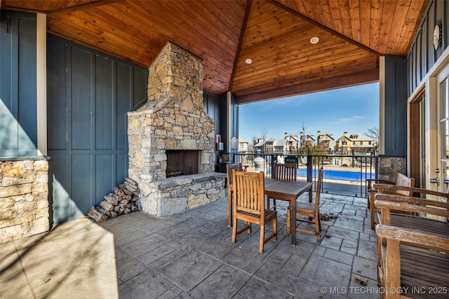 view of patio with an outdoor stone fireplace