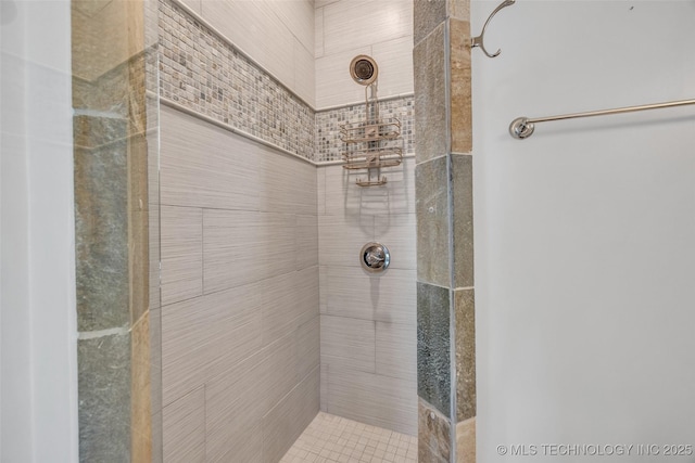 bathroom with a tile shower