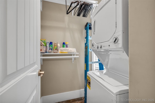 laundry area with stacked washer / dryer