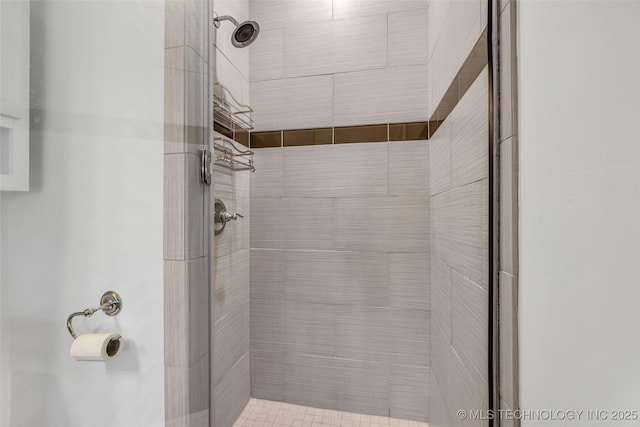 bathroom with a tile shower