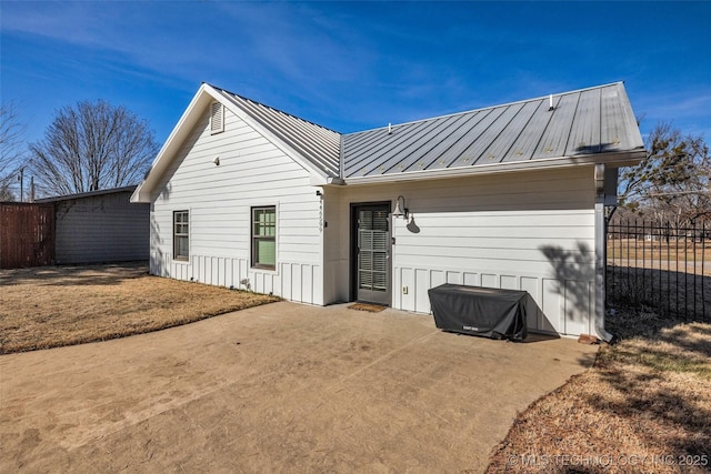 back of house with a patio