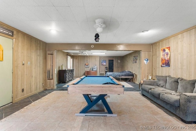 rec room with pool table and wooden walls