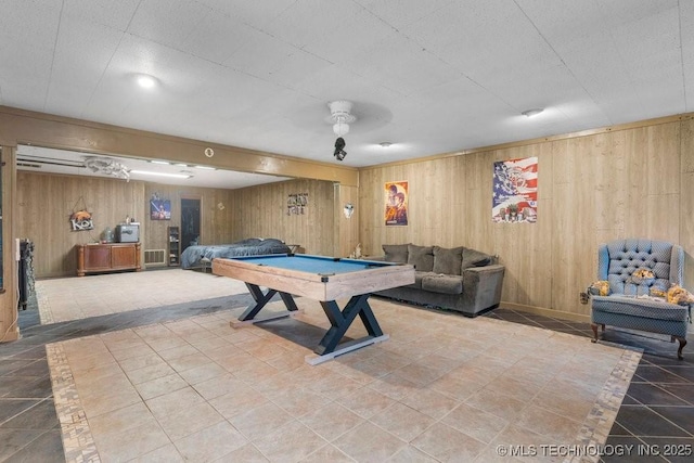 game room with pool table, tile patterned floors, and wooden walls