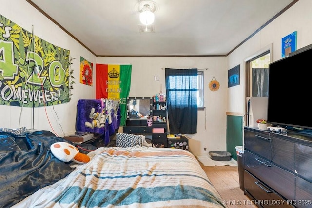 bedroom with ornamental molding