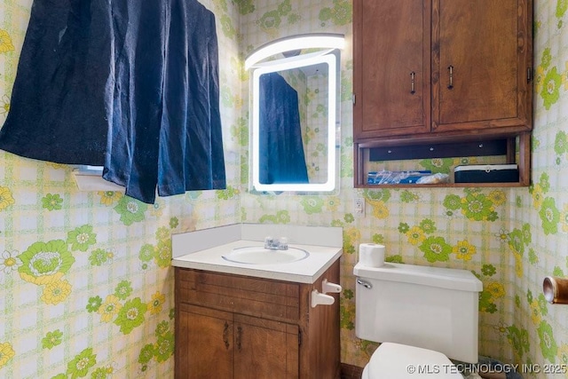 bathroom with vanity and toilet