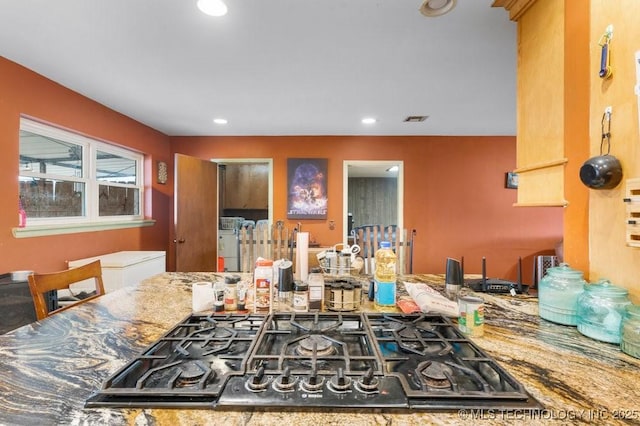 kitchen featuring gas cooktop and stone countertops