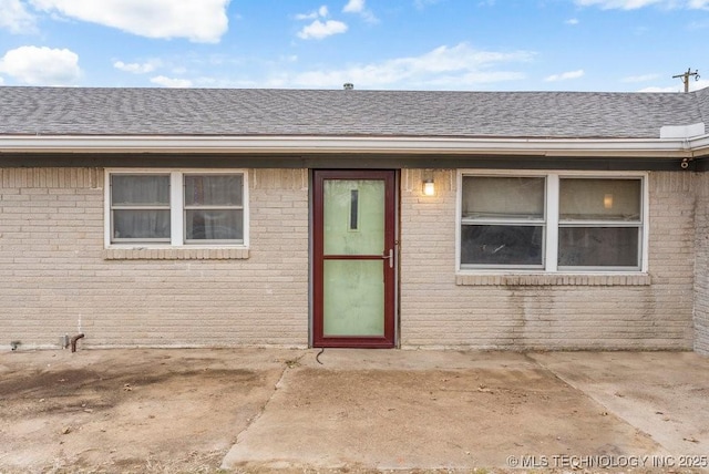 property entrance with a patio area