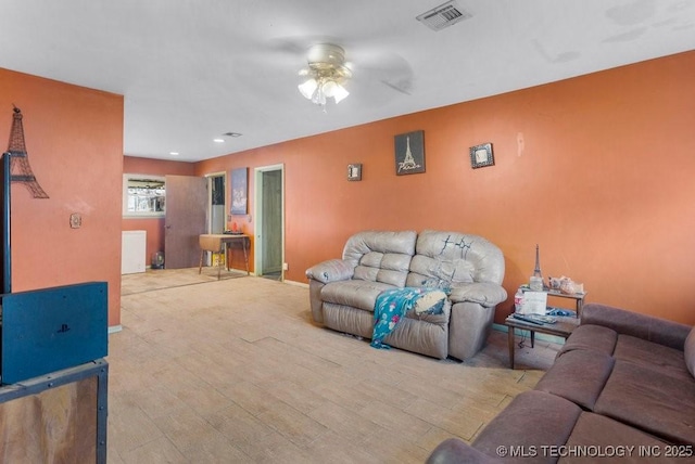 living room featuring ceiling fan