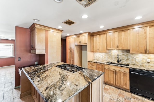 kitchen with gas cooktop, visible vents, stone counters, a sink, and dishwasher