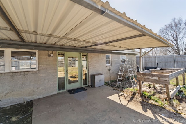 view of patio / terrace with a garden and fence