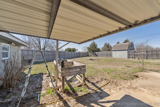 view of yard featuring an outdoor structure and a fenced backyard