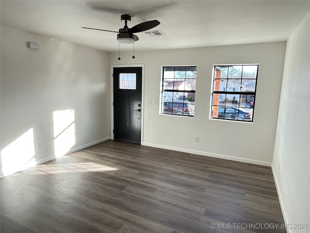 foyer with dark hardwood / wood-style floors and ceiling fan