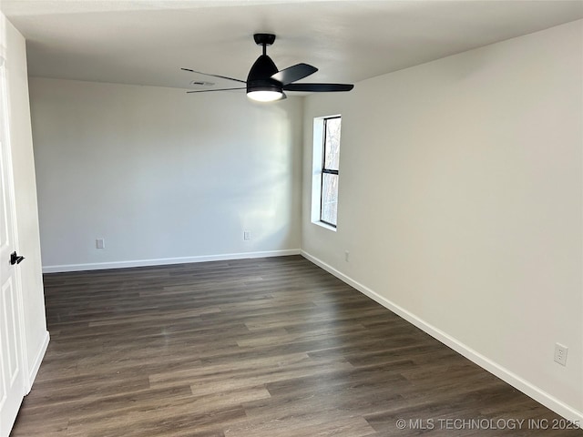 unfurnished room featuring dark hardwood / wood-style floors and ceiling fan