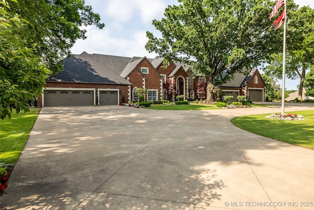 view of front facade with a garage and a front lawn