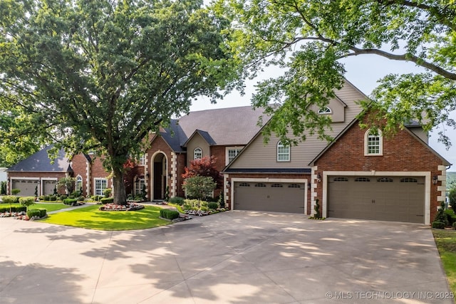 view of front of property featuring a garage and a front yard