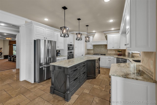 kitchen with appliances with stainless steel finishes, a center island, custom exhaust hood, and white cabinets