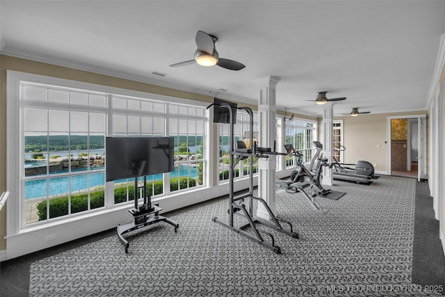 exercise room with decorative columns, ornamental molding, carpet flooring, and ceiling fan