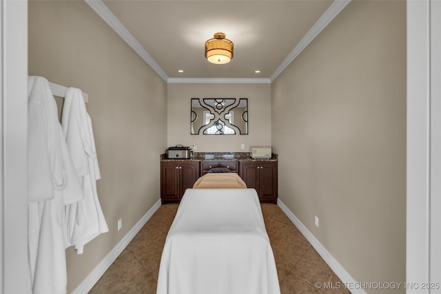 tiled bedroom featuring crown molding